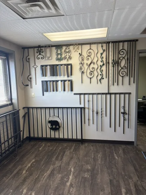 Decorative wrought iron scrollwork and baluster samples on display at The Ornamental Man showroom in Colorado Springs
