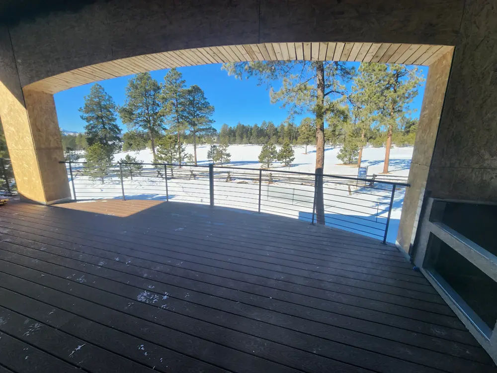 Exterior Covered Porch Iron Railing In Snow