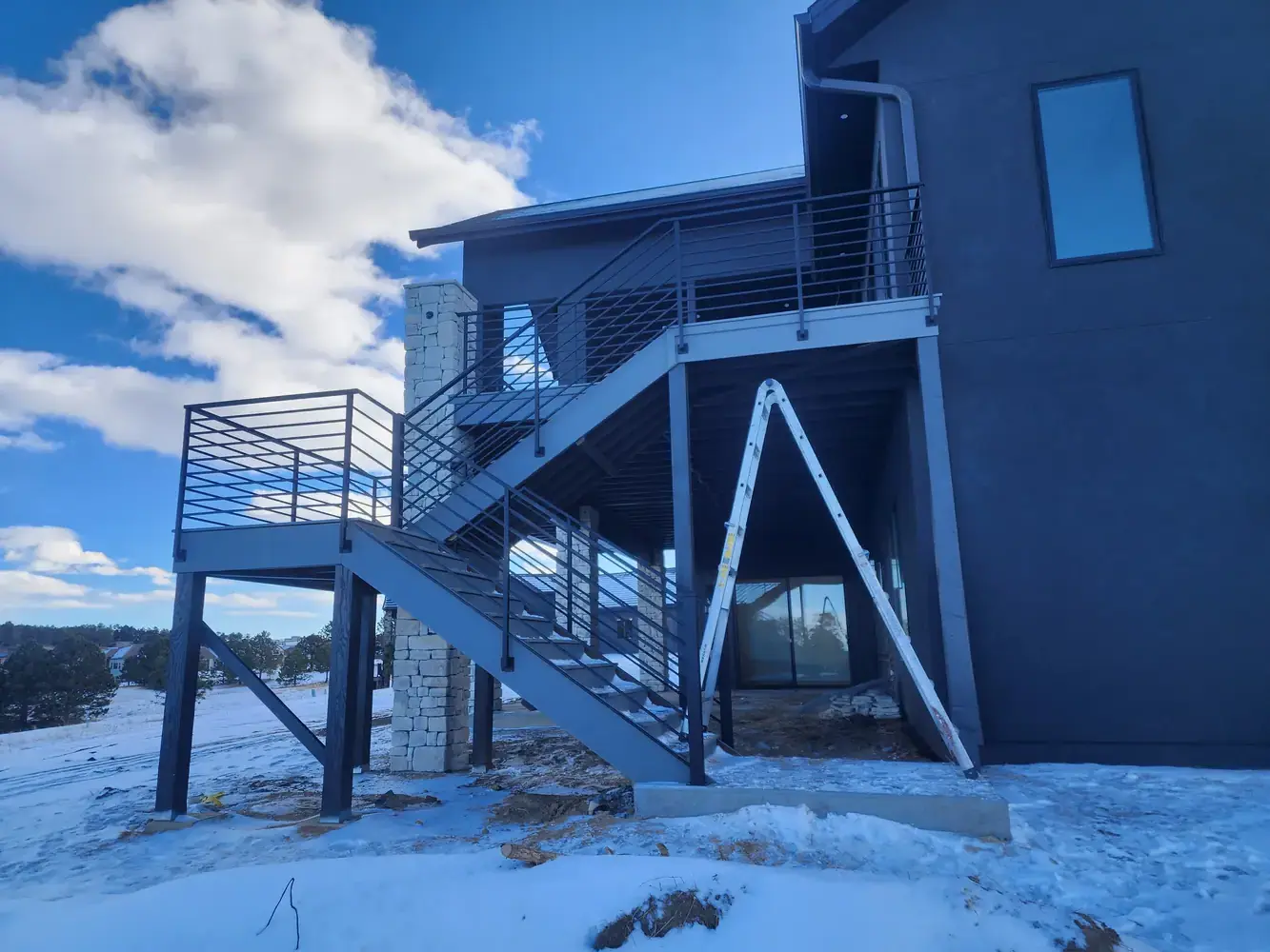 Custom iron stair railing fabrication for Colorado Springs contractors and builders