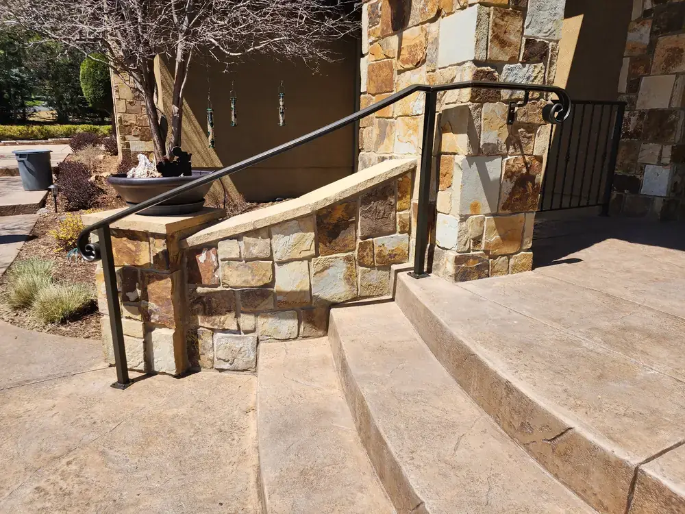 Curved Iron Railing on Stone Stairway