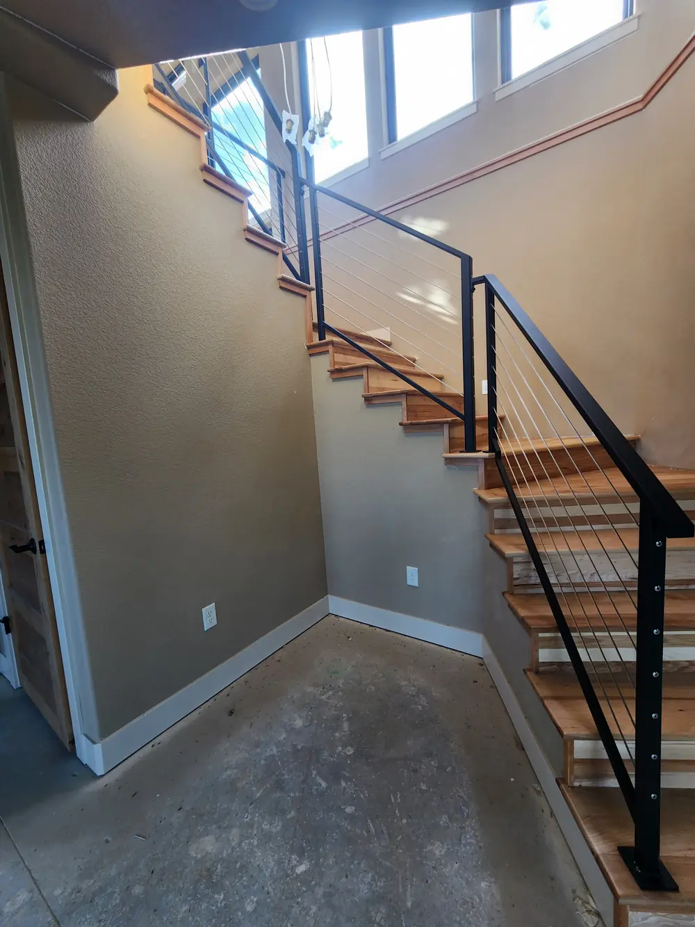 Modern stair iron railing with glass window detail